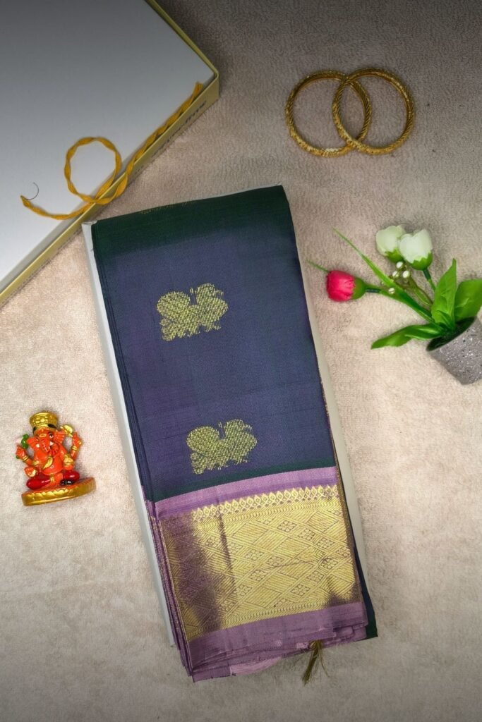 Peacock blue silk saree in dual-tone blue-green with wine double-sided border