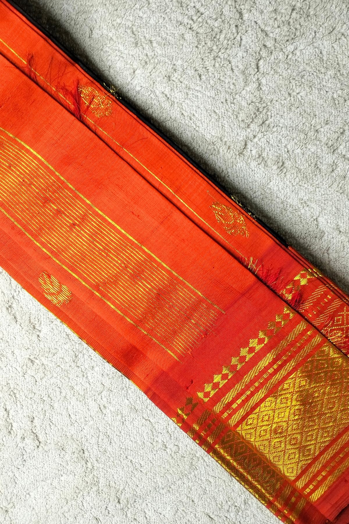 Orange pallu black thirubuvanam saree