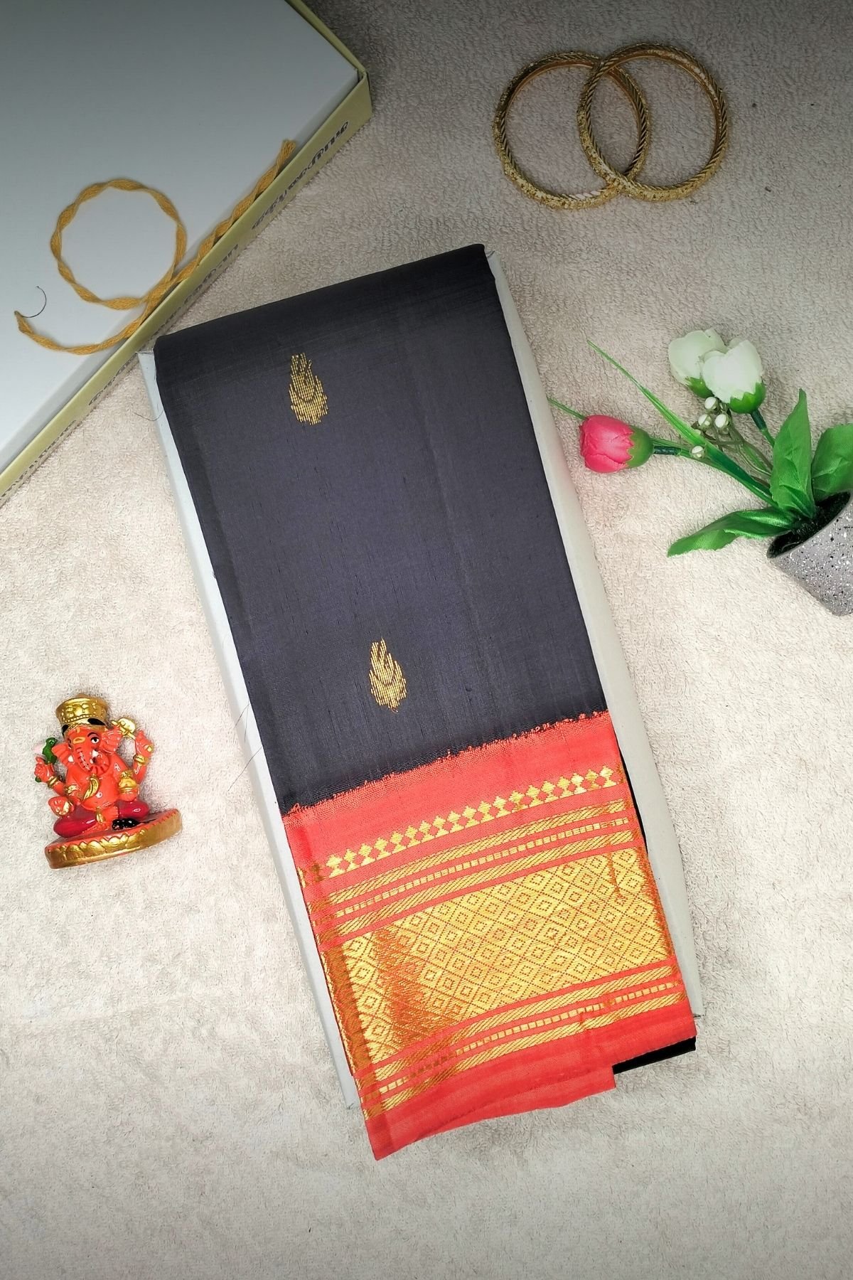 black handloom silk saree iwth orange border