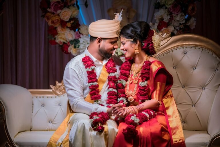 Bride and groom in traditional wedding clothes during Tamil wedding rituals