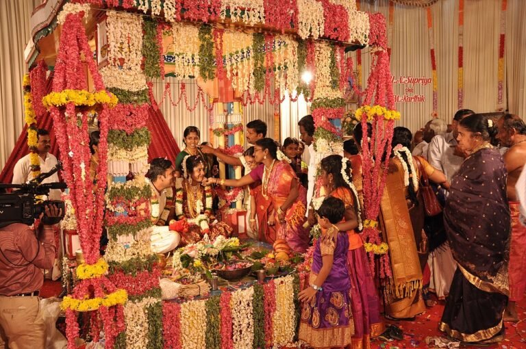 A newly married Tamil couple being blessed by elders